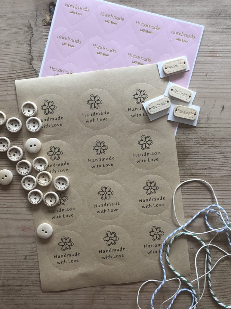 variety of sticky labels, wooden buttons and string