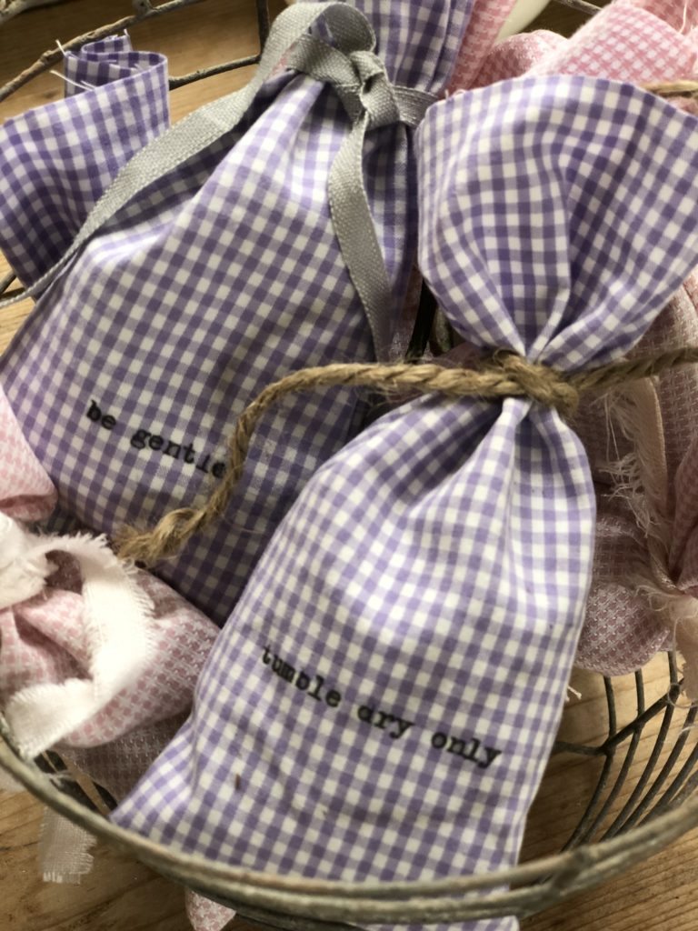 homemade lavender dryer bags with typewritten labels tied with string