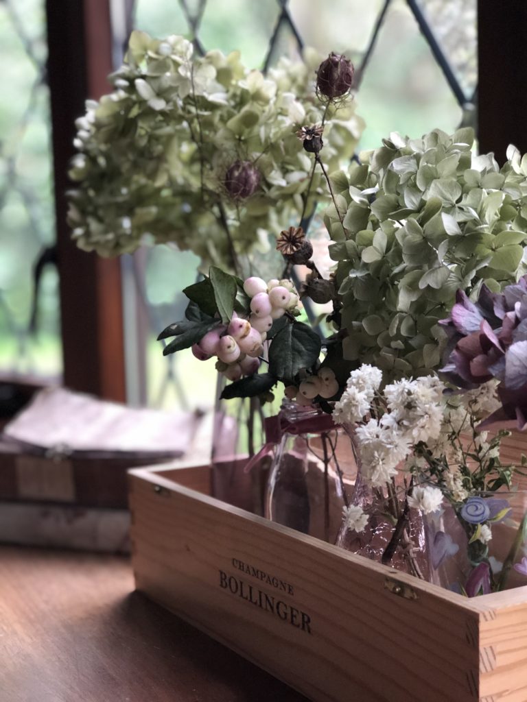 hydrangeas and seed heads used in autumn window decoration