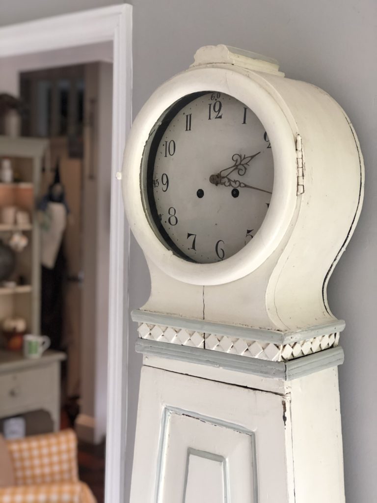 white mora clock in farmhouse