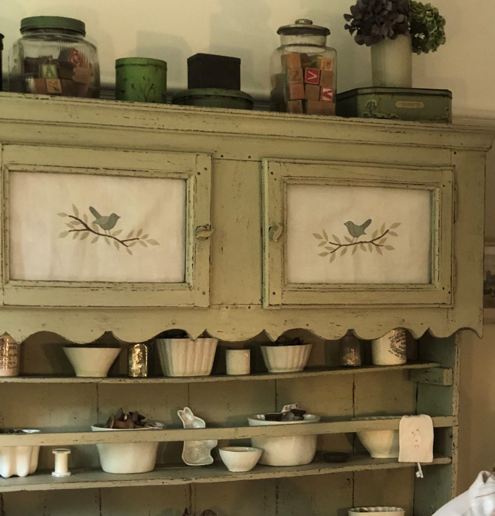 rustic dresser with vintage crockery