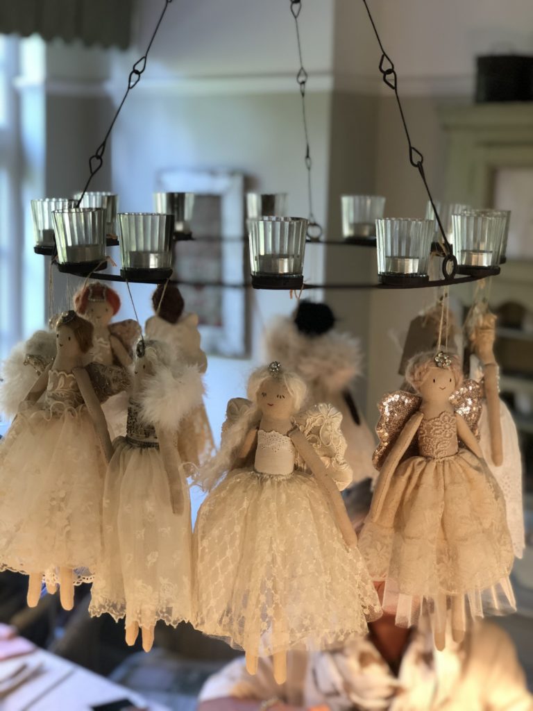 heirloom fairies hang from candleabra