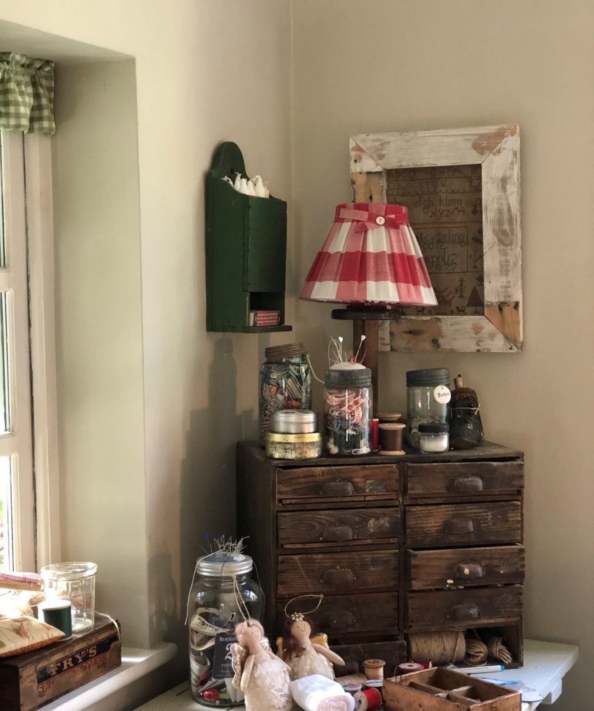 homespun haberdashery corner with gingham light and wooden draws