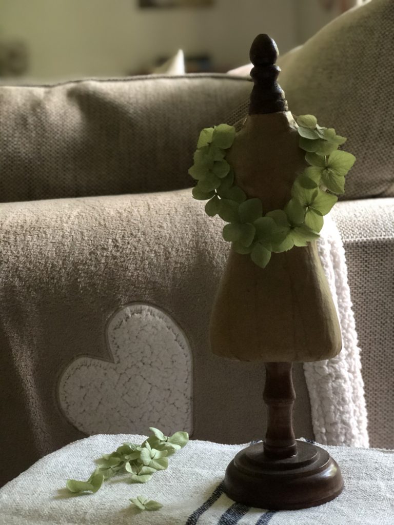 green hydrangea petal decoration on mannequin for simple autumn decorating ideas