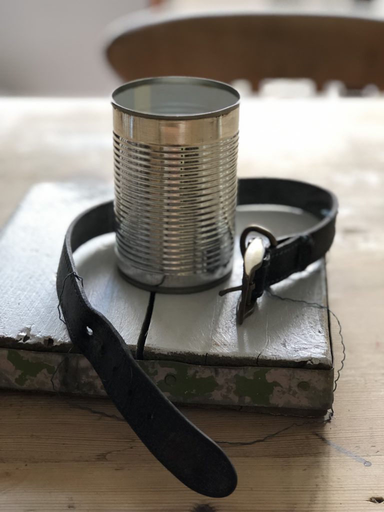 tin can, board and dog collar