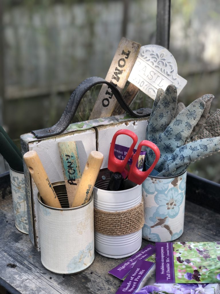 homemade tin can organiser hold essential gardening equipment