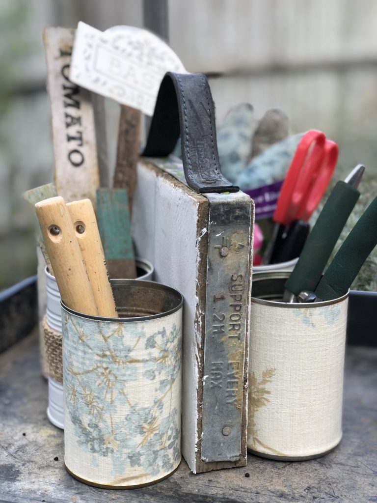 homemade tin can organiser hold essential gardening equipment