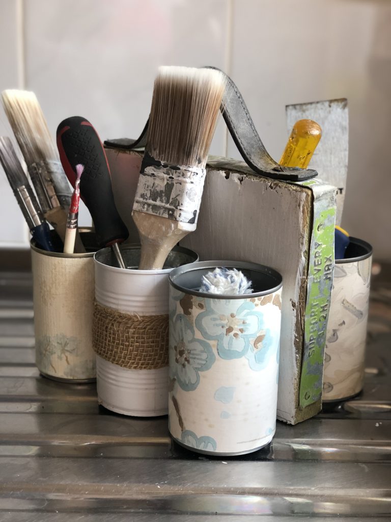 homemade tin caddy with paint brushes 