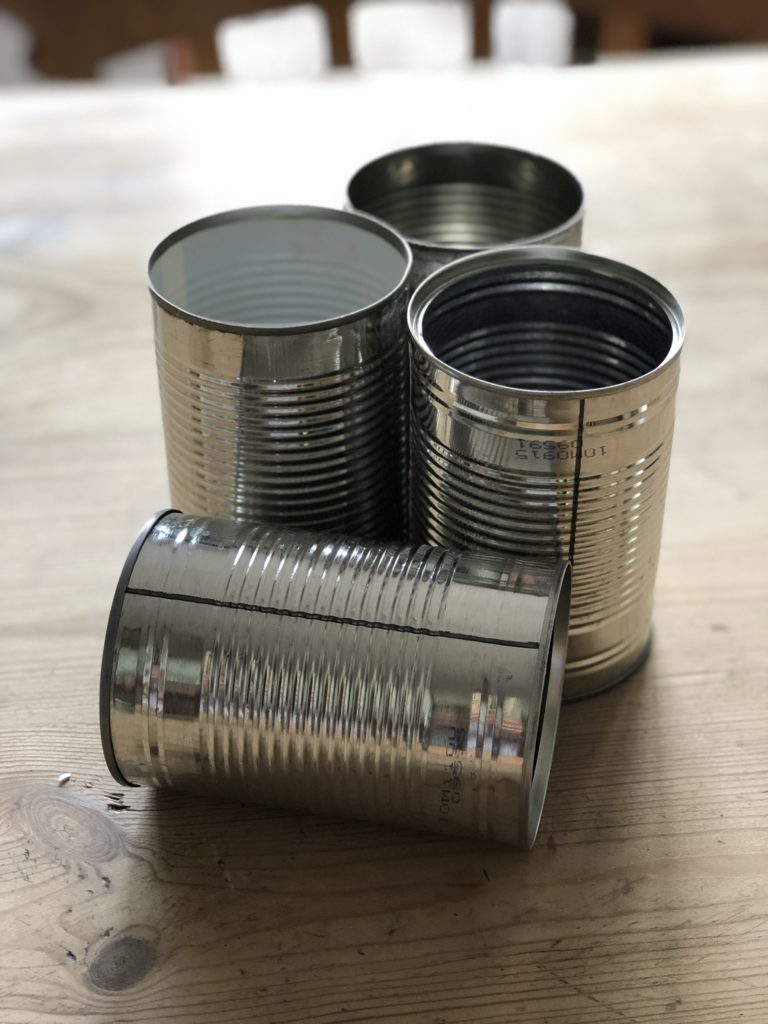 four empty tin cans