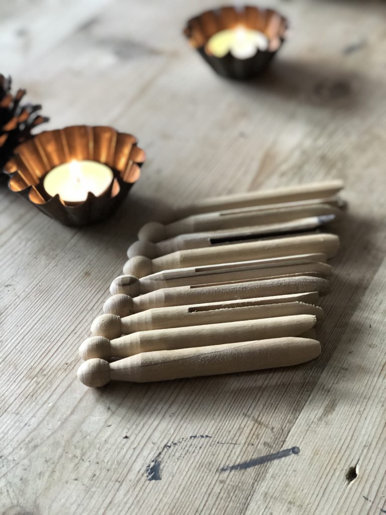 Wooden dolly pegs and tealight