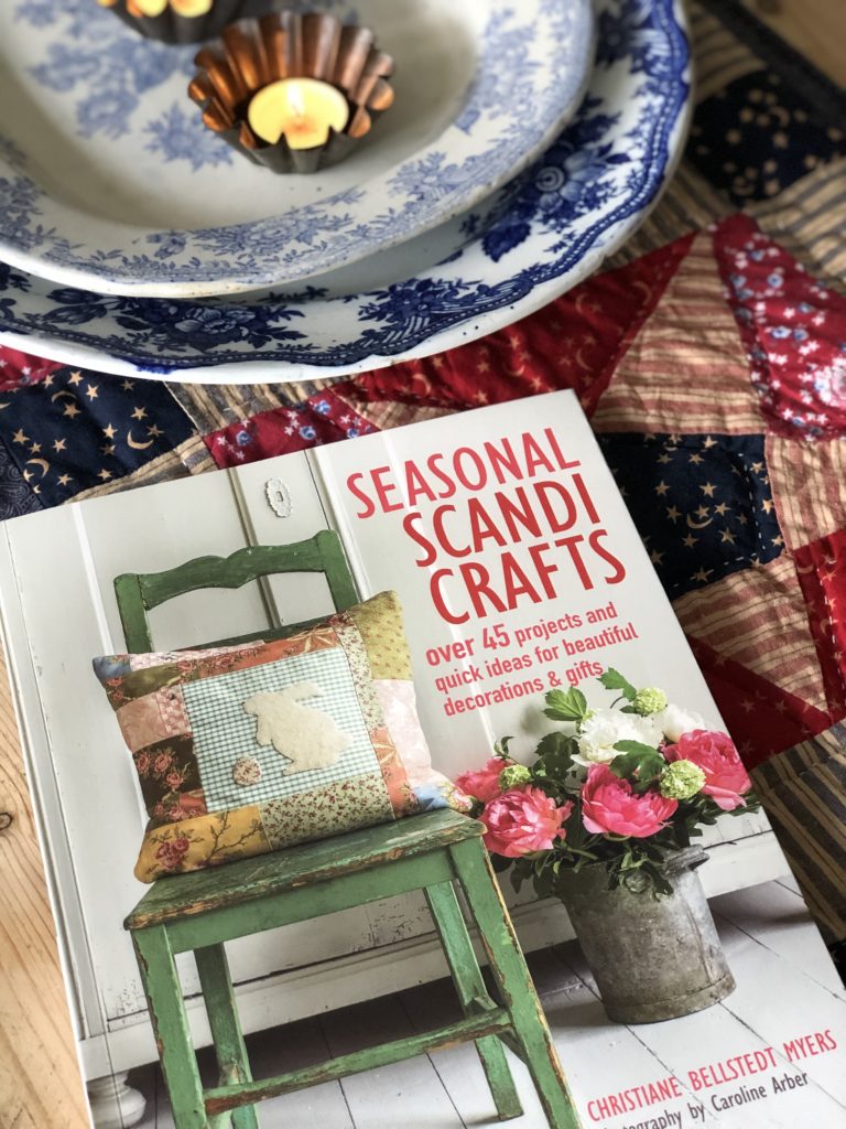 craft book on table cloth