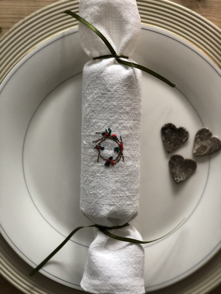 flatlay of handmade linen christmas cracker