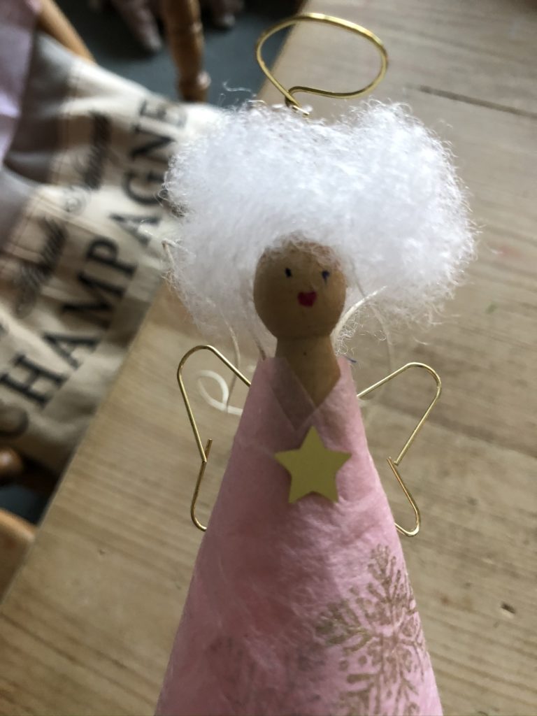 pink peg doll fairy with lots of white hair