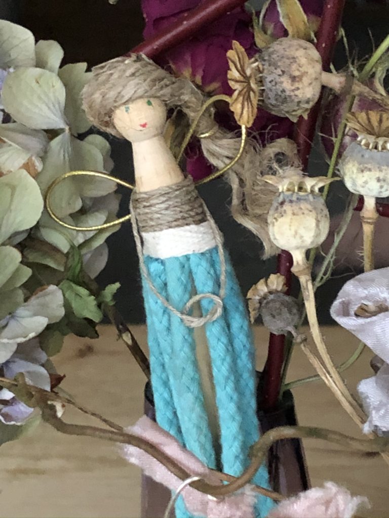 completed peg doll flower fairy with clothes and hair made from string