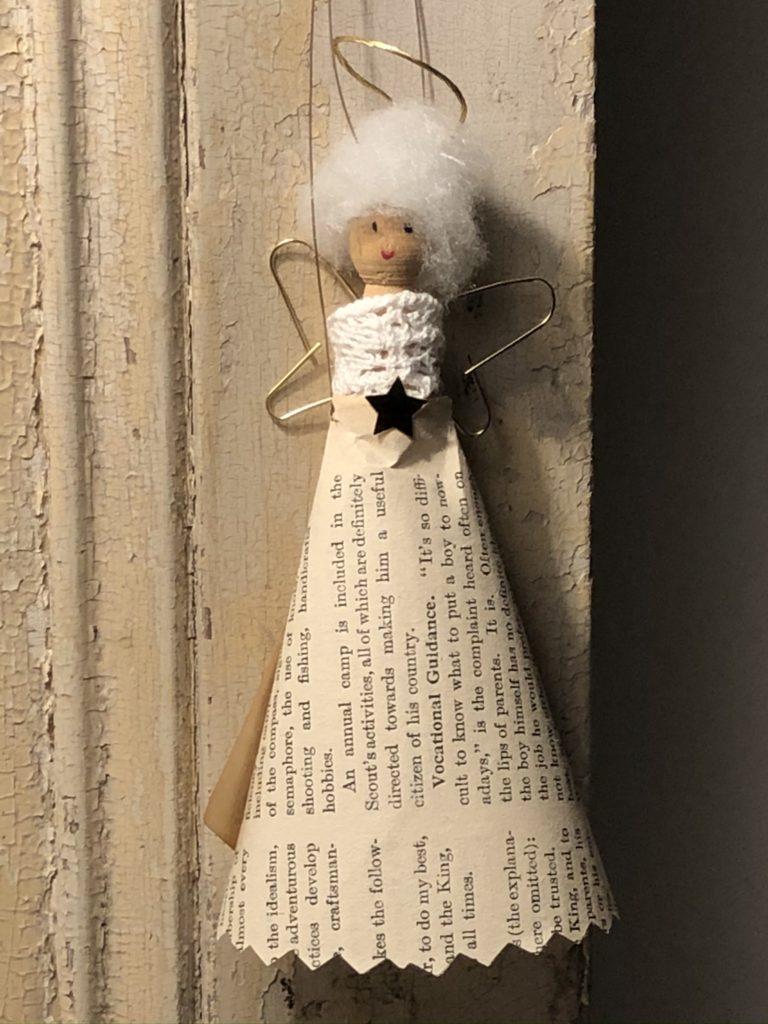 Homemade Peg doll fairy with book paper skirt