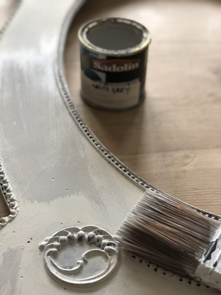 painting grey paint over chalk base on aged picture frame