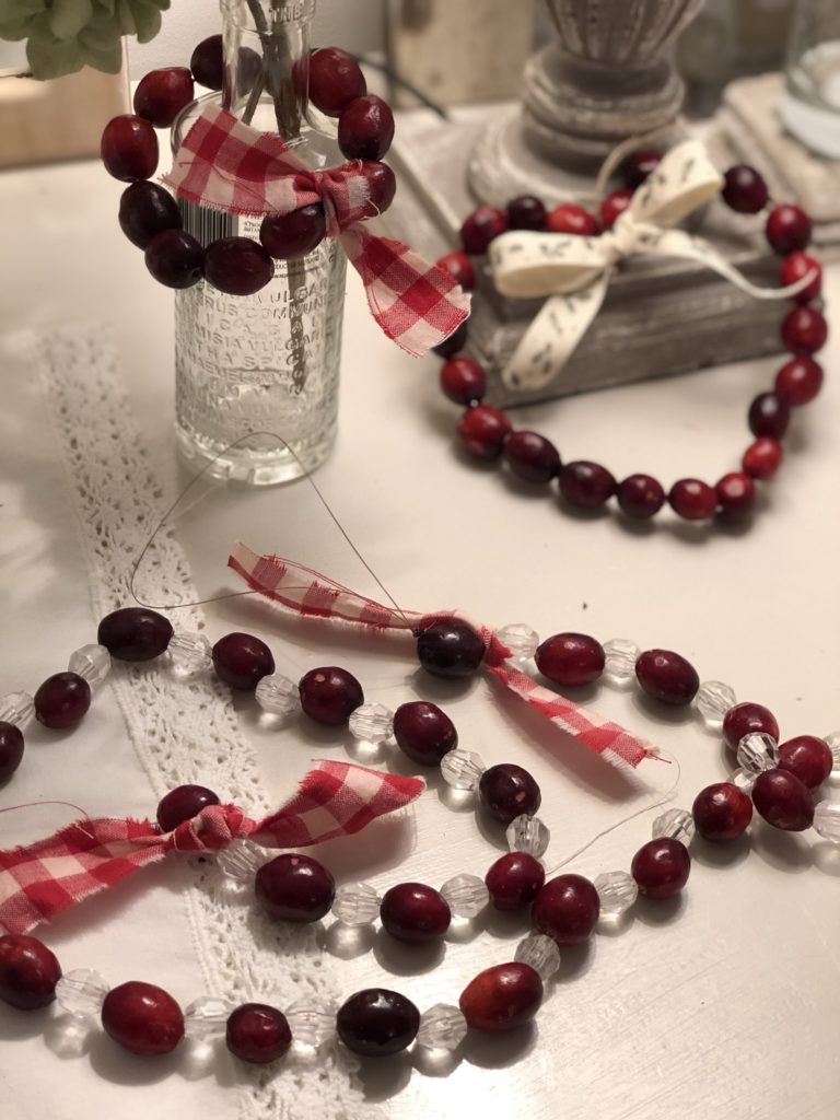 cranberries being made into homemade rustic decorations