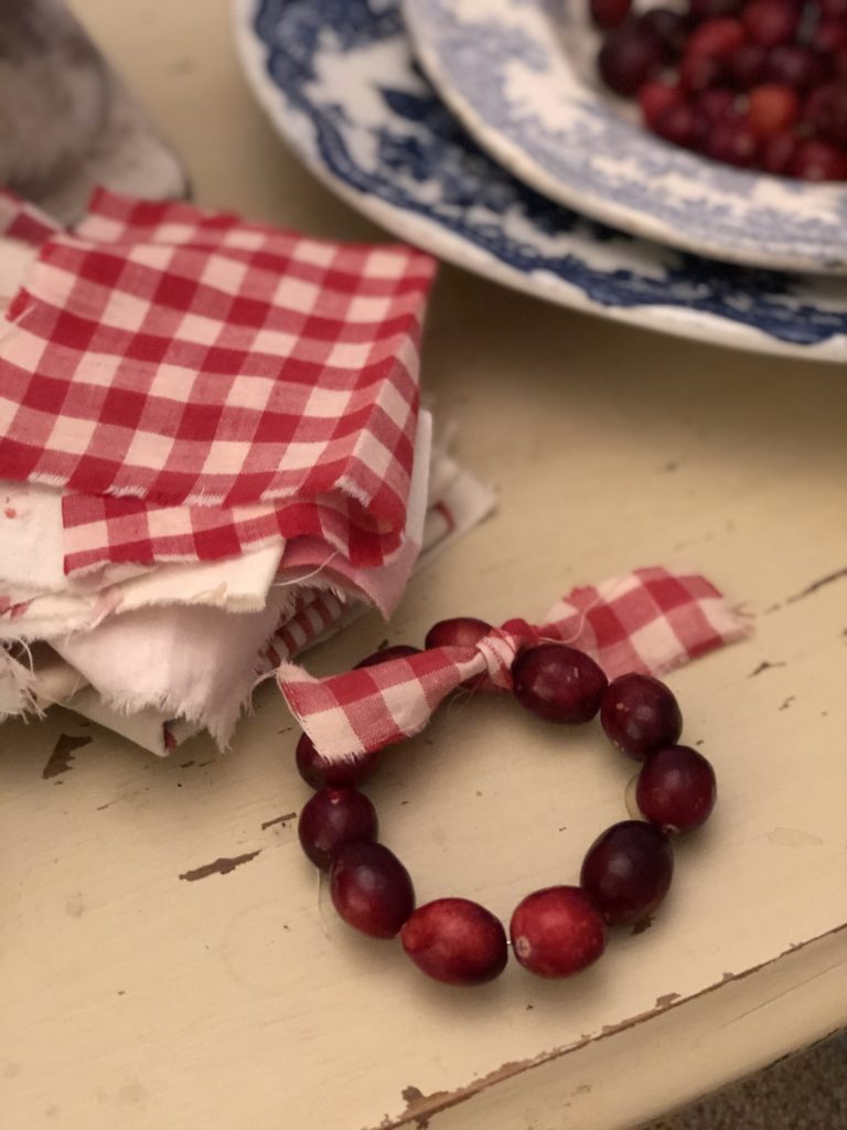 cranberry wreath with red gingham fabric 