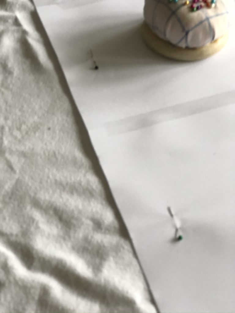 pinning paper template to fabric