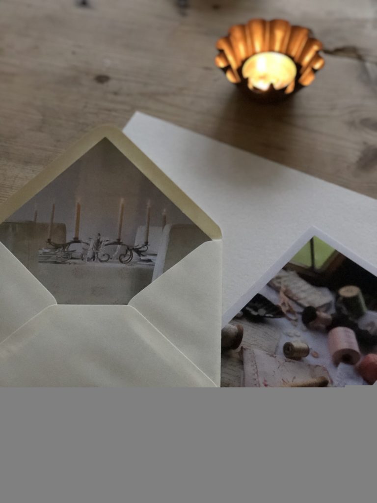 lined envelope paper and candle