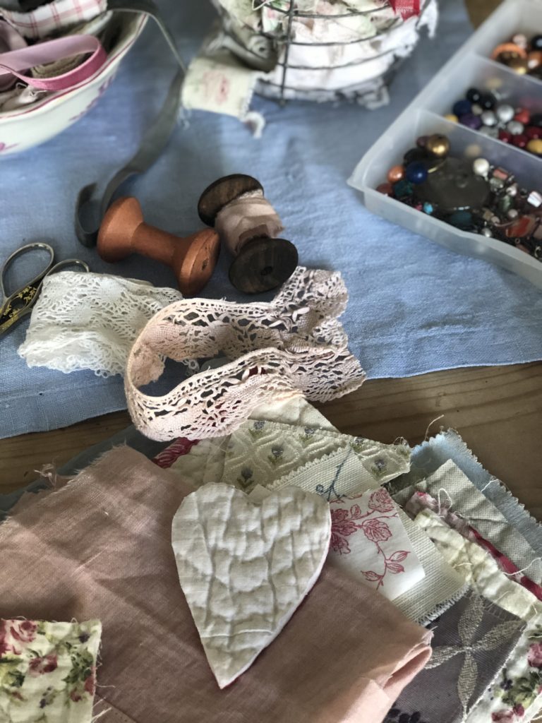 materials and ribbons and lace to make fabric heart brooch