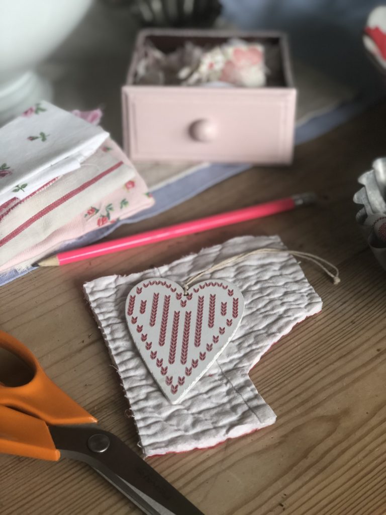 heart tag materials and pink pencil