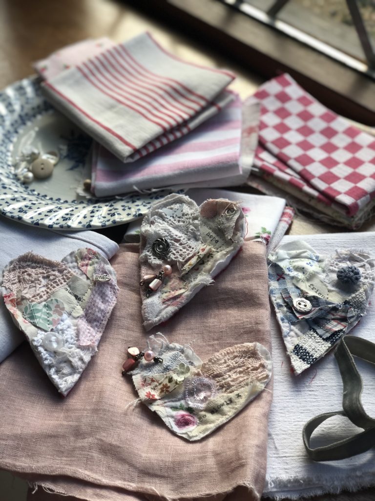 four vintage fabric heart brooches