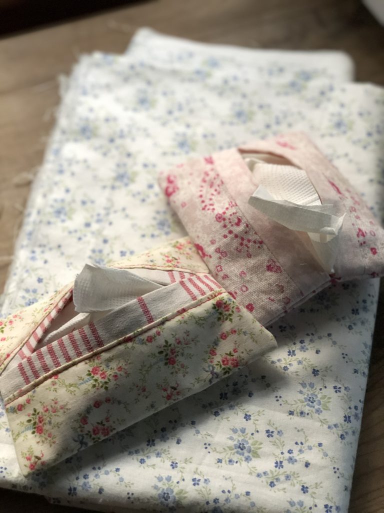 two homemade fabric pocket tissue holders