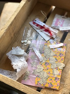 filling a wooden storage crate with crafty bits