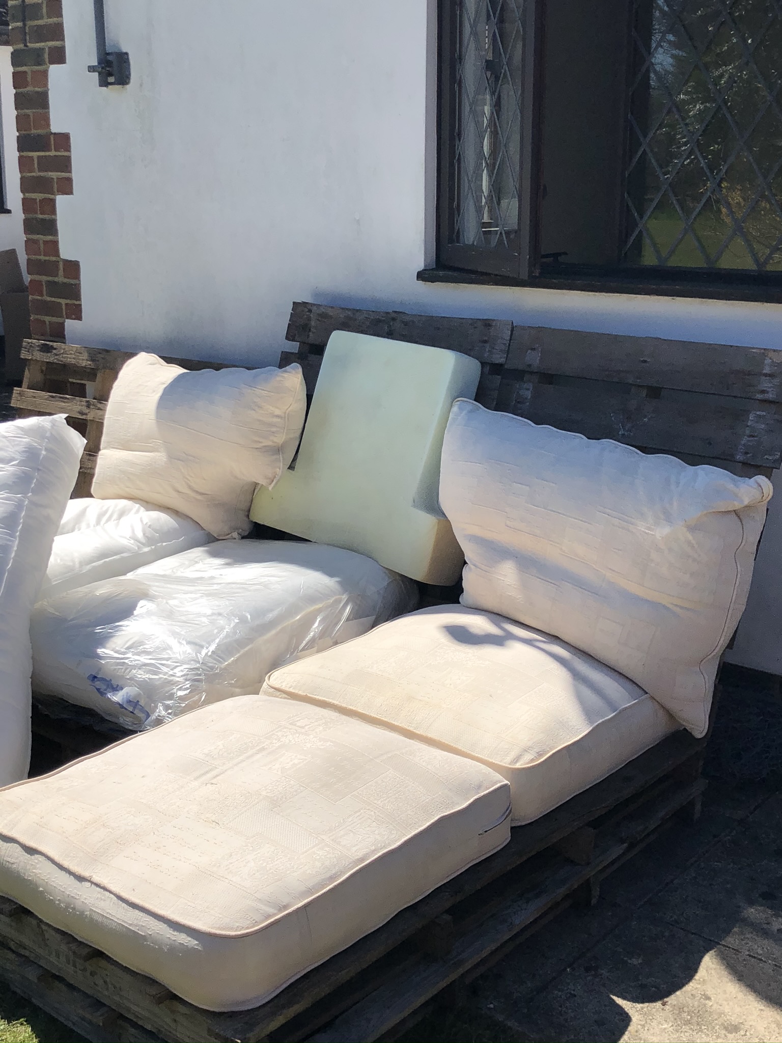 A DIY Wooden Pallet Sofa Part Two complete with pallet cushions