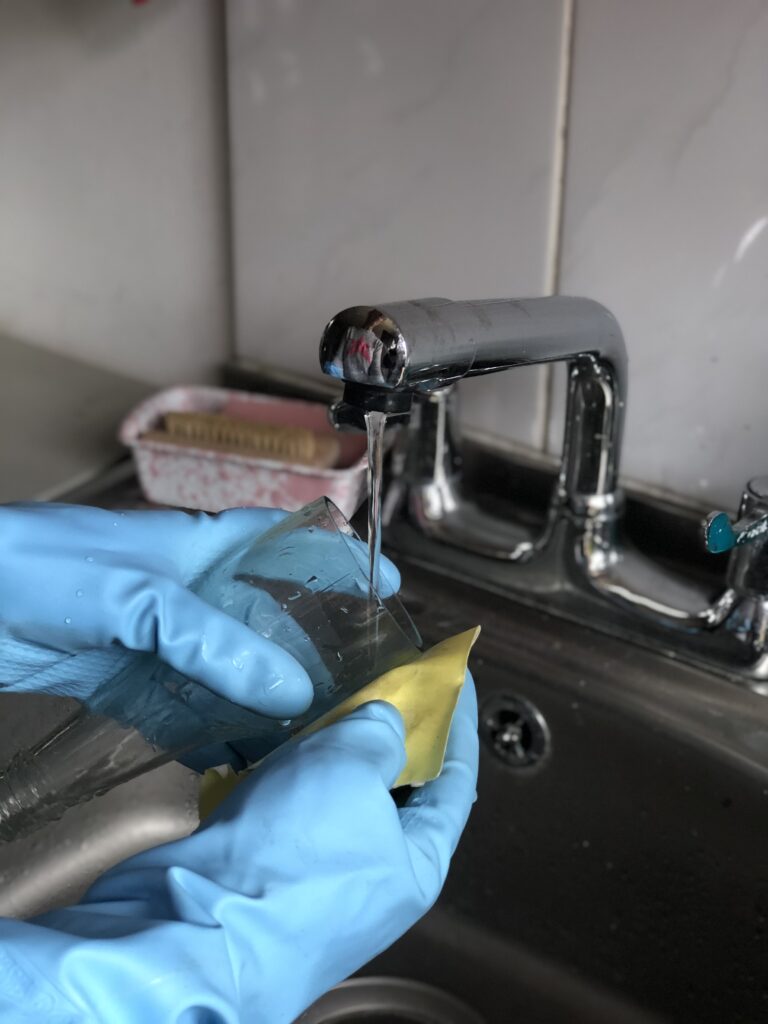 wet sanding a glass bottle