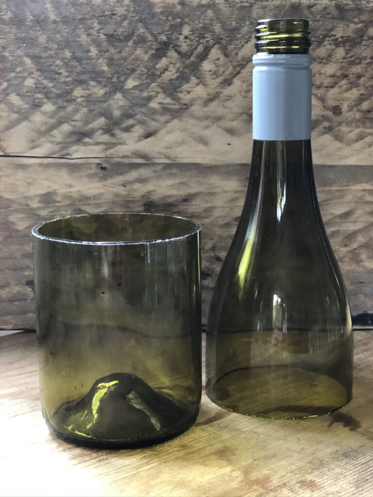 green wine bottle cut in two pieces