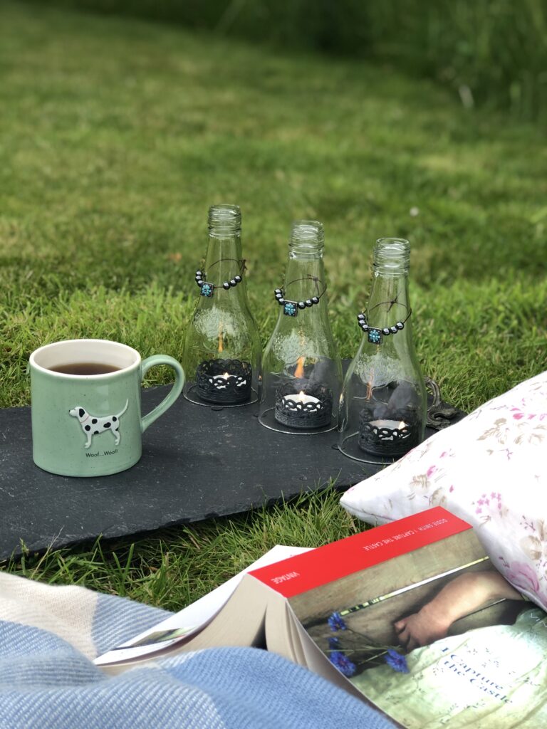 wine bottle centrepiece with coffee cup and book