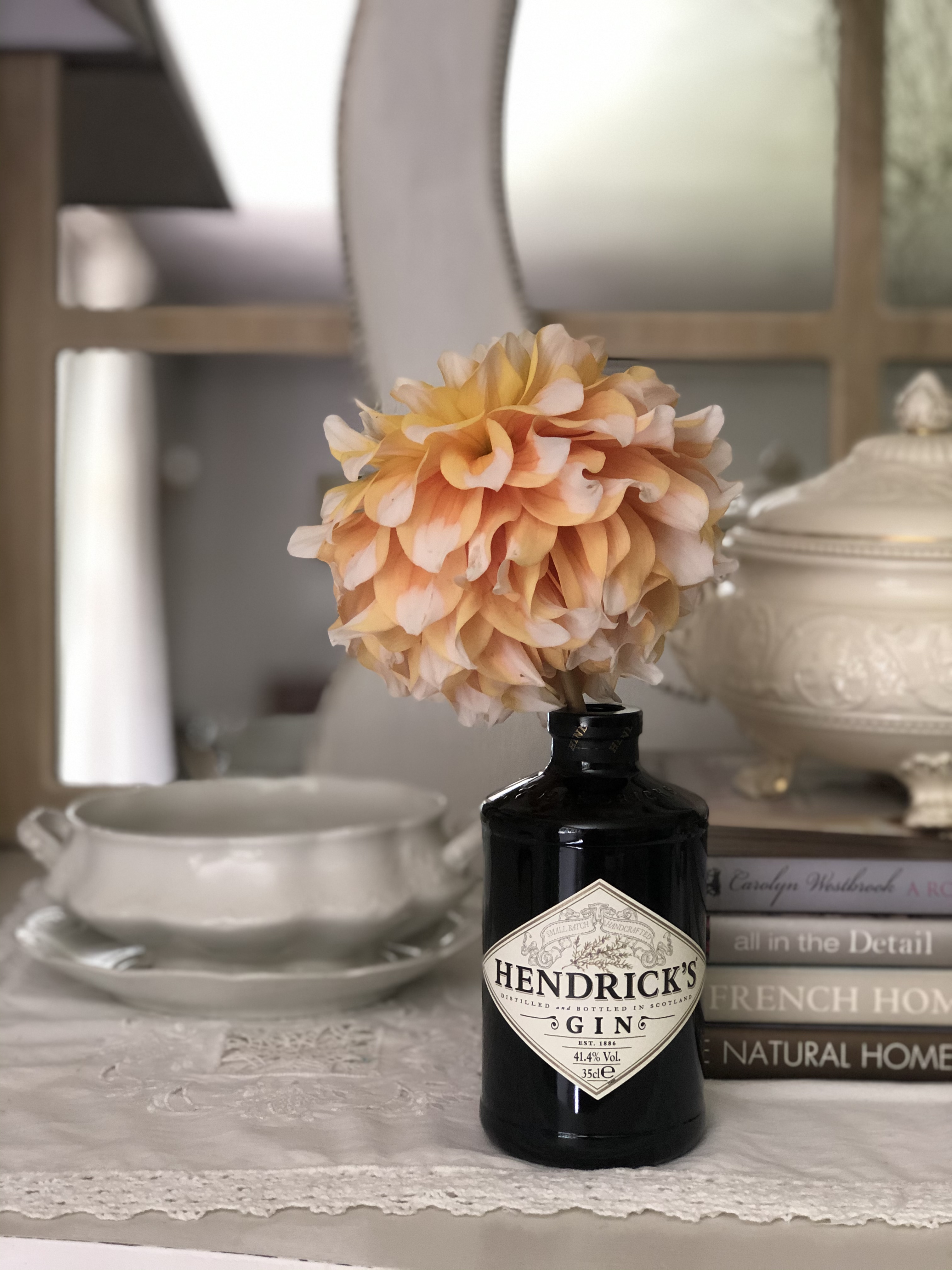 Hendrick's Gin bottle and yellow dahlia