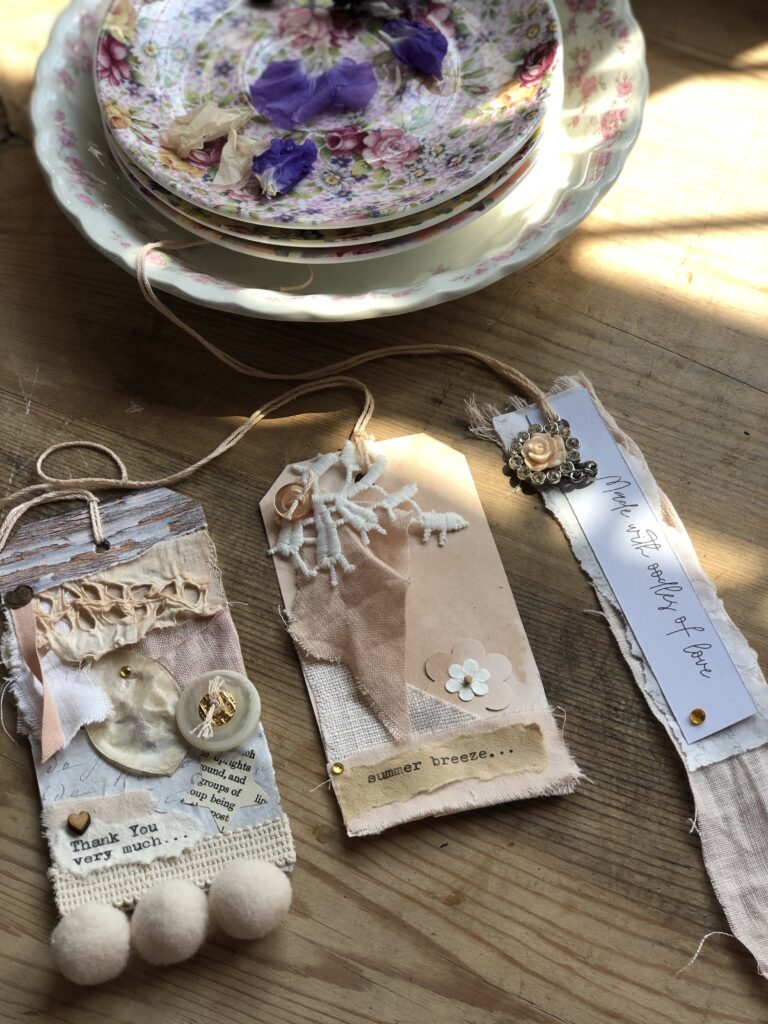 three gift tags made with avocado dyed linens and card