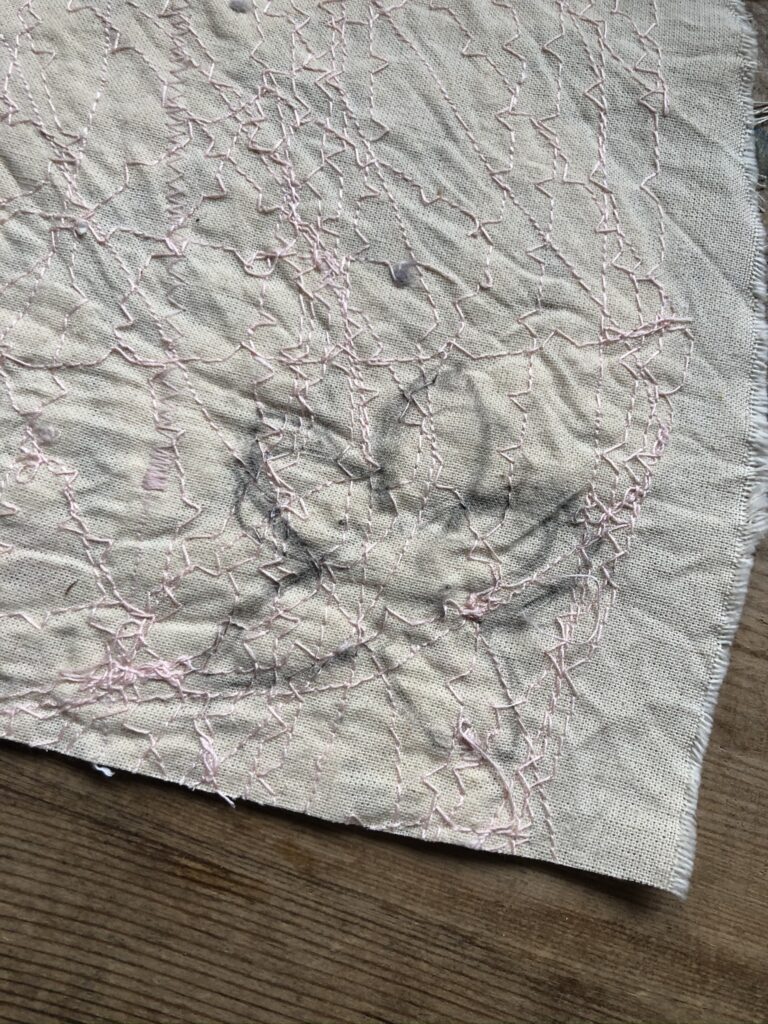 rough sketch of flower on reverse of fabric