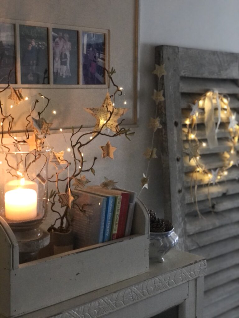 3D paper star decorations with fairy lights and wreath