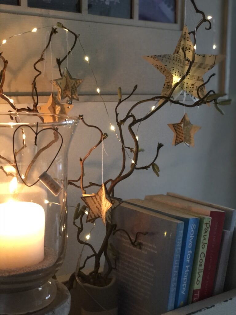 3D paper star decorations with fairy lights and wreath