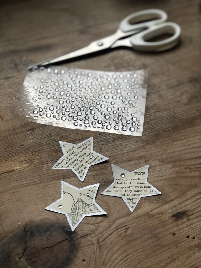 paper stars decorated with gem stones