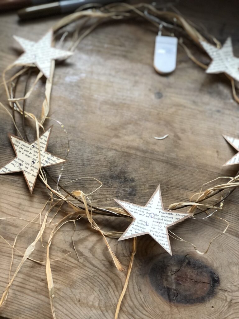 paper star wreath on rusty wire