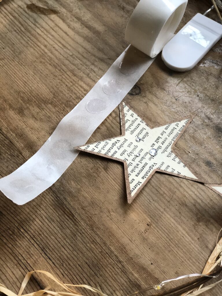 decorated paper star with gem stones