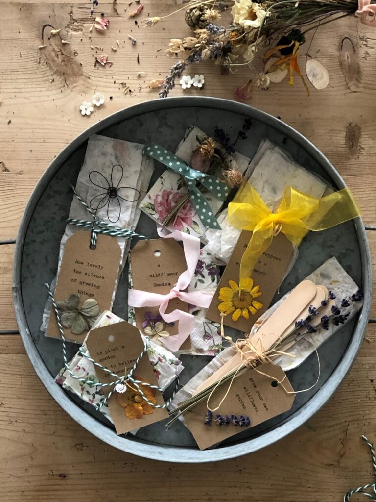 flatlay of lots of homemade seed paper ready to gift in bundles