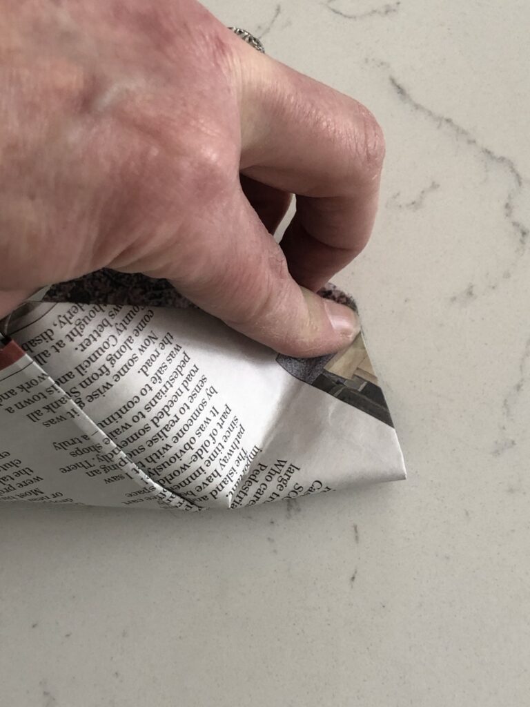 where to crease the paper to create the bottom of the pot