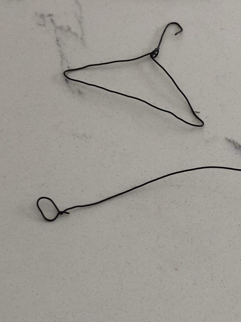 making wire coat hanger for mini garden bunting