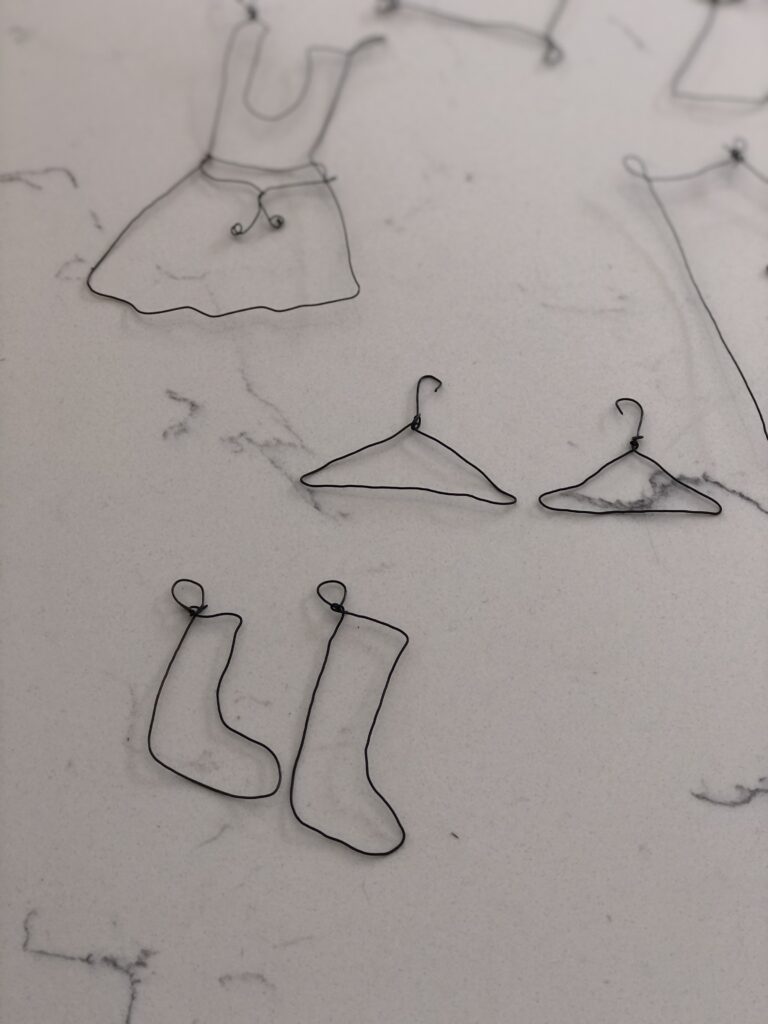 wire craft socks and coat hangers for mini garden bunting project