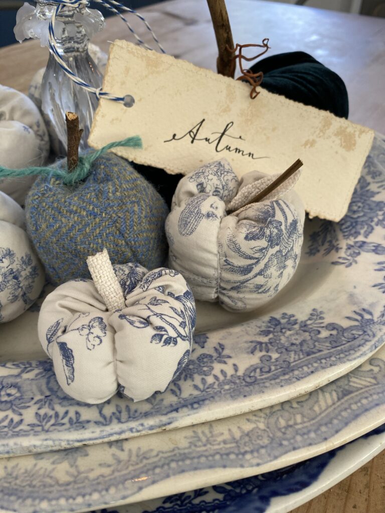 blue fabric apples and pumpkins with calligraphy autumn label