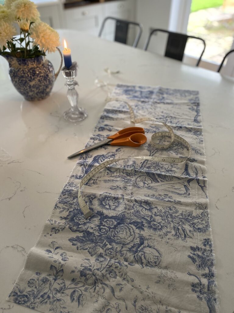 blue toile fabric scissors and tape