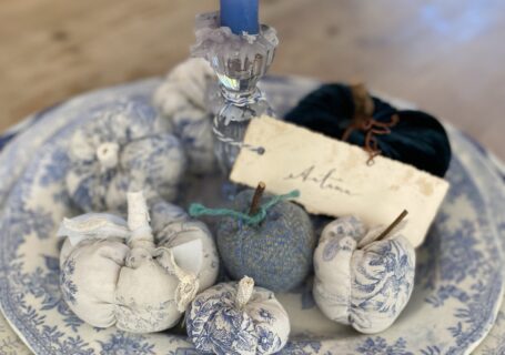 a pretty platter of blue easy fabric pumpkins and candle