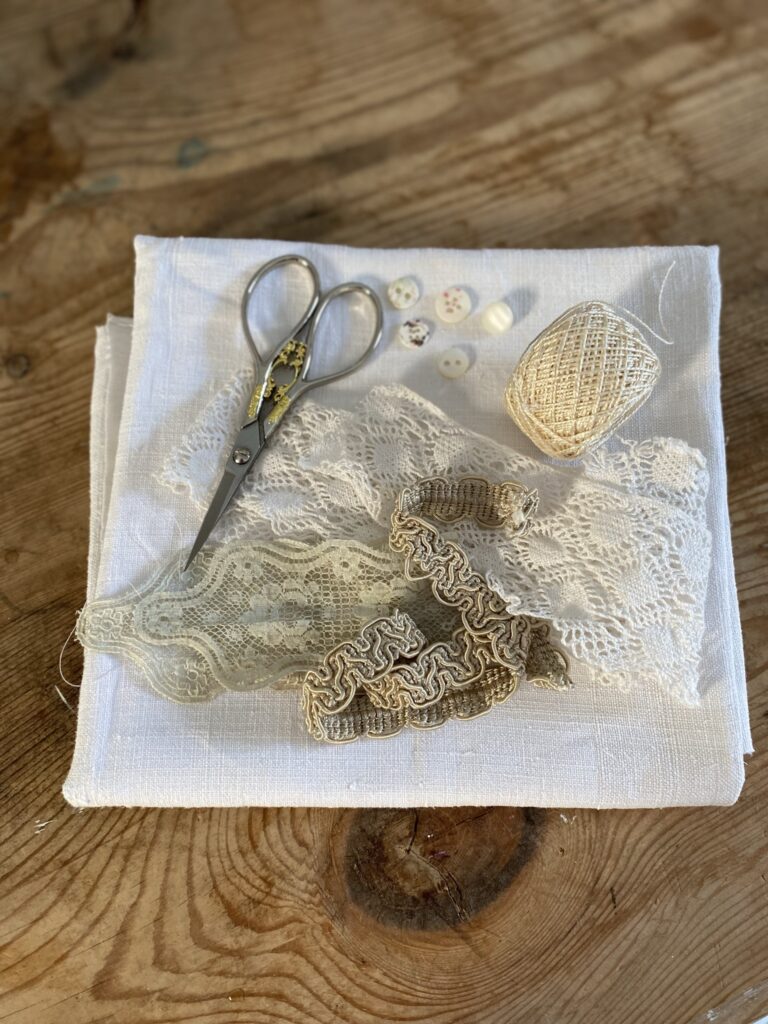 lace and linen and scissor flat lay