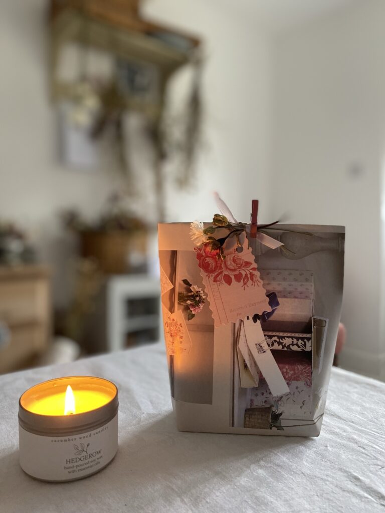 homemade paper gift bag with lit candle in tin 